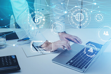 Double exposure of businessman hand working with business documents at office workspace with laptop computer with social media diagram with graph chart