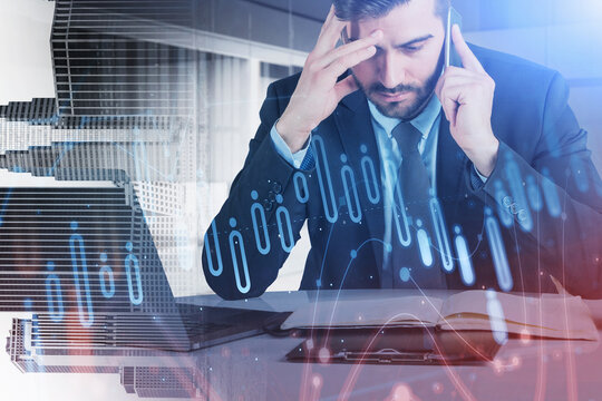 Business man or stock trader analyzing stock graph chart by fibo