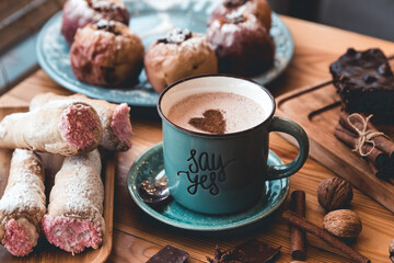 Cup of coffee on wooden table.