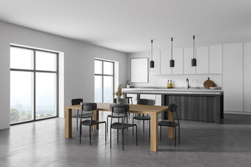 Modern kitchen interior with white gray walls, a concrete floor and gray countertops. A long table with chairs near it. mock up poster on wall. 3d rendering