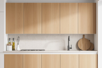 Modern kitchen interior with white walls, wooden countertops with a built in sink and a cooker. 3d rendering