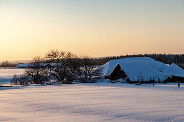 Winter landscape with a house