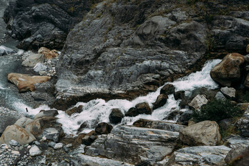 Rocky Waterfall in flowing down into small rocky river, in Hualien Taiwan.