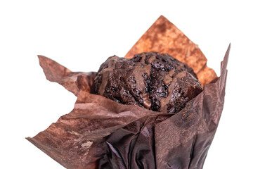 Chocolate muffin with chocolate icing, in parchment paper