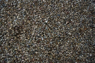 A wide overhead shot of a rounded river rock gravel bed. 
