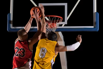 Fotobehang Two basketball players in action. Blocked shot © Andrey Burmakin