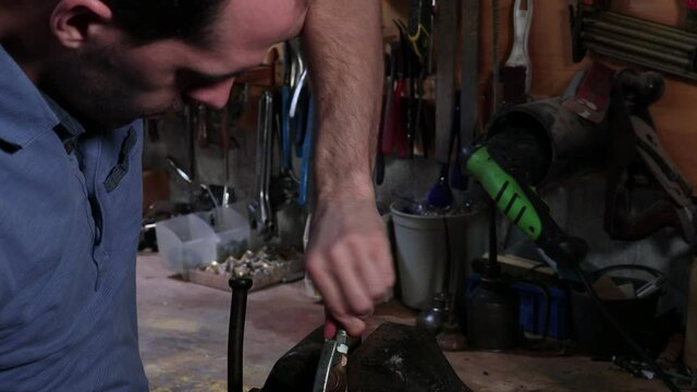 Mechanic Installs and Tightens Part Using a Wrench