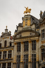 Fototapeta na wymiar Brussels (Bruxelles), Belgium. Belgium. August 17, 2019: Maison de brasseurs on the Grand Place. Golden statue of Charles de Lorraine on the top.