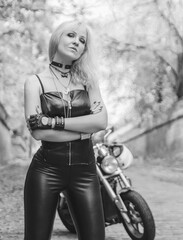 Fototapeta na wymiar Black and white portrait of beautiful biker woman 
