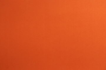 Close up Mottled orange paper background and texture. Orange paper with stripes of paper.