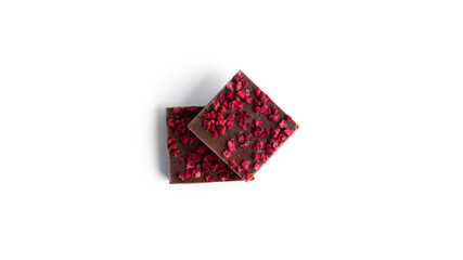 Milk chocolate with raspberry slices isolated on a white background.
