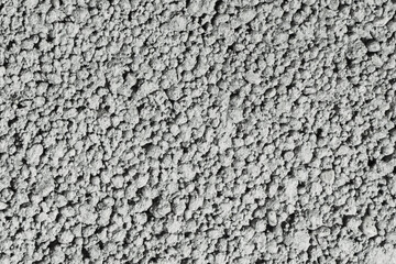 Stucco wall texture. White concrete surface background. Gray plaster wall pattern. Distressed noise backdrop for graphic design. Rough grain cement texture.