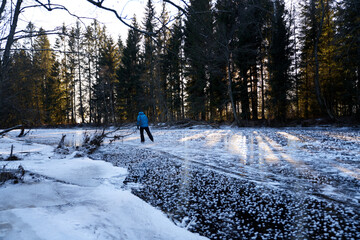 A cold Sunday in January on the frozen local lake or river in just outside of Oslo city. Norwegian families are gathering on the ice for skating and having fun.