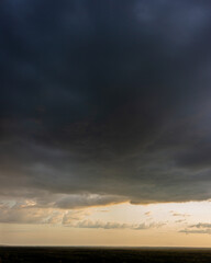Fototapeta na wymiar Evening sky and rain clouds, countryside landscape.