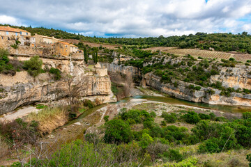 Fototapeta na wymiar Minerve in the South of France is a beautiful city with historic links to the Cathar. The gorge was carved by the river Cesse and the Brian