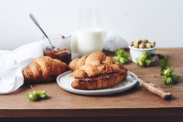 Freshly baked croissants with chocolate cream.