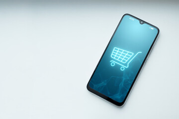 Phone and basket hologram. Online shopping, online store application in a smartphone. Digital Marketing Online.