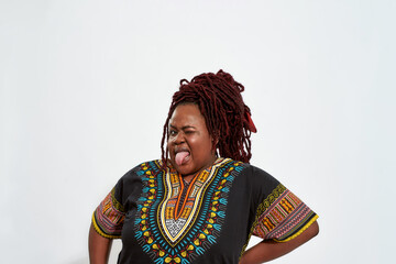 Portrait of plump woman with tongue out and blinking eye