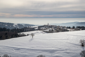 Fototapeta na wymiar mountain top village covered with snow