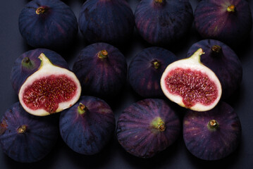 Tasty figs on a black background. Top view.