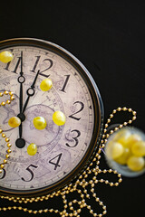 a clock showing just a few minutes before the new years arrives 