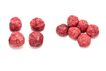 Raw meat balls isolated on white background.