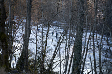 A cold Sunday in January on the frozen local lake or river in just outside of Oslo city. Norwegian families are gathering on the ice for skating and having fun.