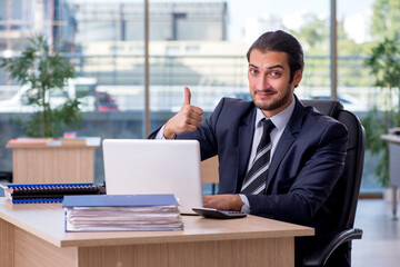 Fototapeta premium Young businessman employee working in the office