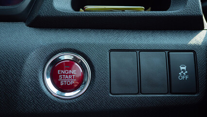 A red button for start the engine of the car. Modern vehicles use a remote key and a single push...