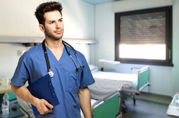 Male nurse holding a case history in a hospital room
