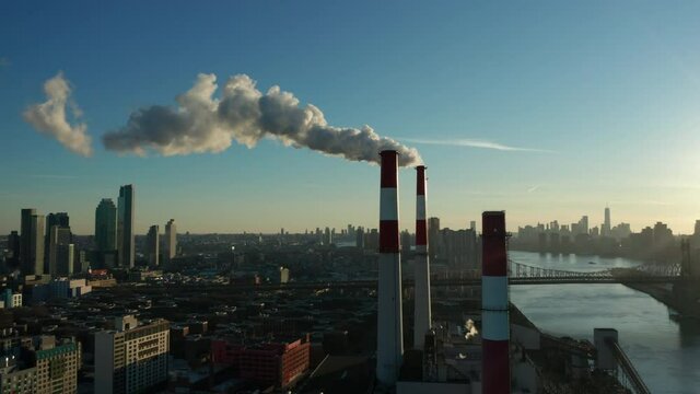 late afternoon flying clockwise around smoking LIC power plant