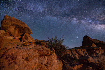 Milky way galaxy over rock formations in western Colorado