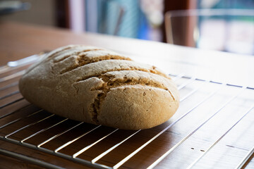 Freshly baked homemade wholemeal bread on a wooden table