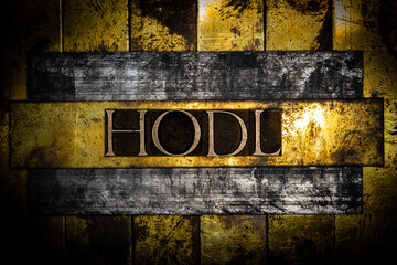 Hodl text on grunge textured copper and gold steampunk style background