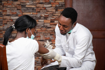 medical personnel injecting a patient