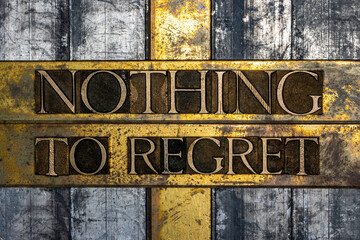 Nothing to Regret text on vintage textured grunge copper and gold background