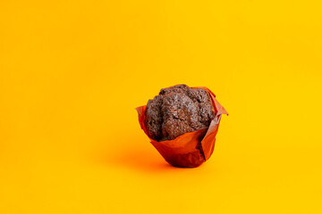 simple black chocolate muffin, dessert traditional food, abstract isolated object on the color background