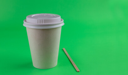 recyclable disposable cardboard cup with green background