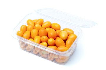 Healthy eating concept: Bunch of delicious fresh kumquats in plastic package on white background. Organic food with full of vitamins.  