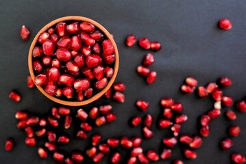 pomegranate seeds on black