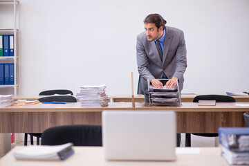 Fototapeta premium Young male employee in industrial espionage concept
