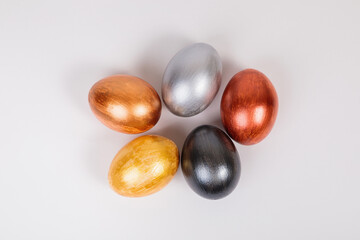 Multi-colored eggs on a uniform white background with place for text.