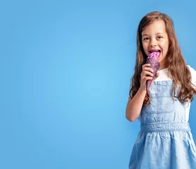 Foto op Canvas Portrait of a cute girl eating ice-cream © konradbak