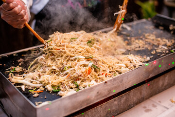 chef cooking noodles
