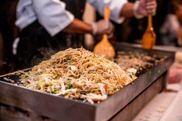 chef cooking noodles