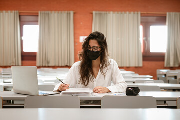 Latin Female Student wearing mask at university