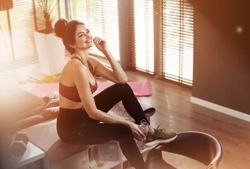 Foto op Canvas Pretty fit lady drinikng water after training © konradbak