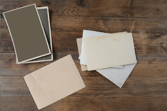empty mock up background of old wood, set of vintage photos with blank, back side of the photo, concept family genealogy, memories, generational ties, museum historical materials