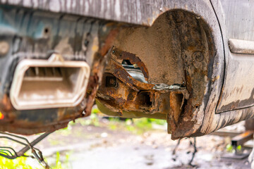 The rusty old interior of the car is not restored. The car body after many years of operation