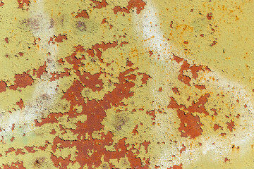 An old metal painted sheet of iron. The background is aged iron sheet.